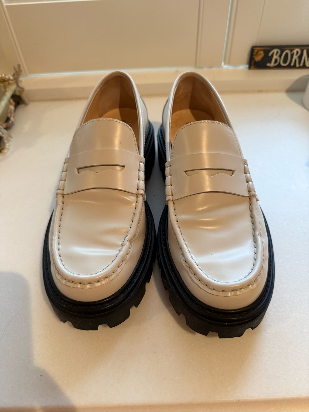 Tod’s Women’s White Leather Penny Loafers with Black Lug Sole - Picture 1 of 7